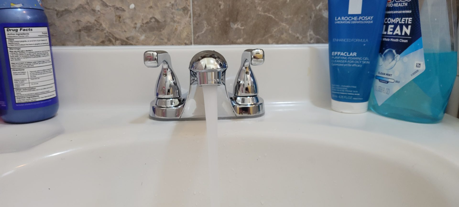 Bathroom faucet loose and dripping water hose