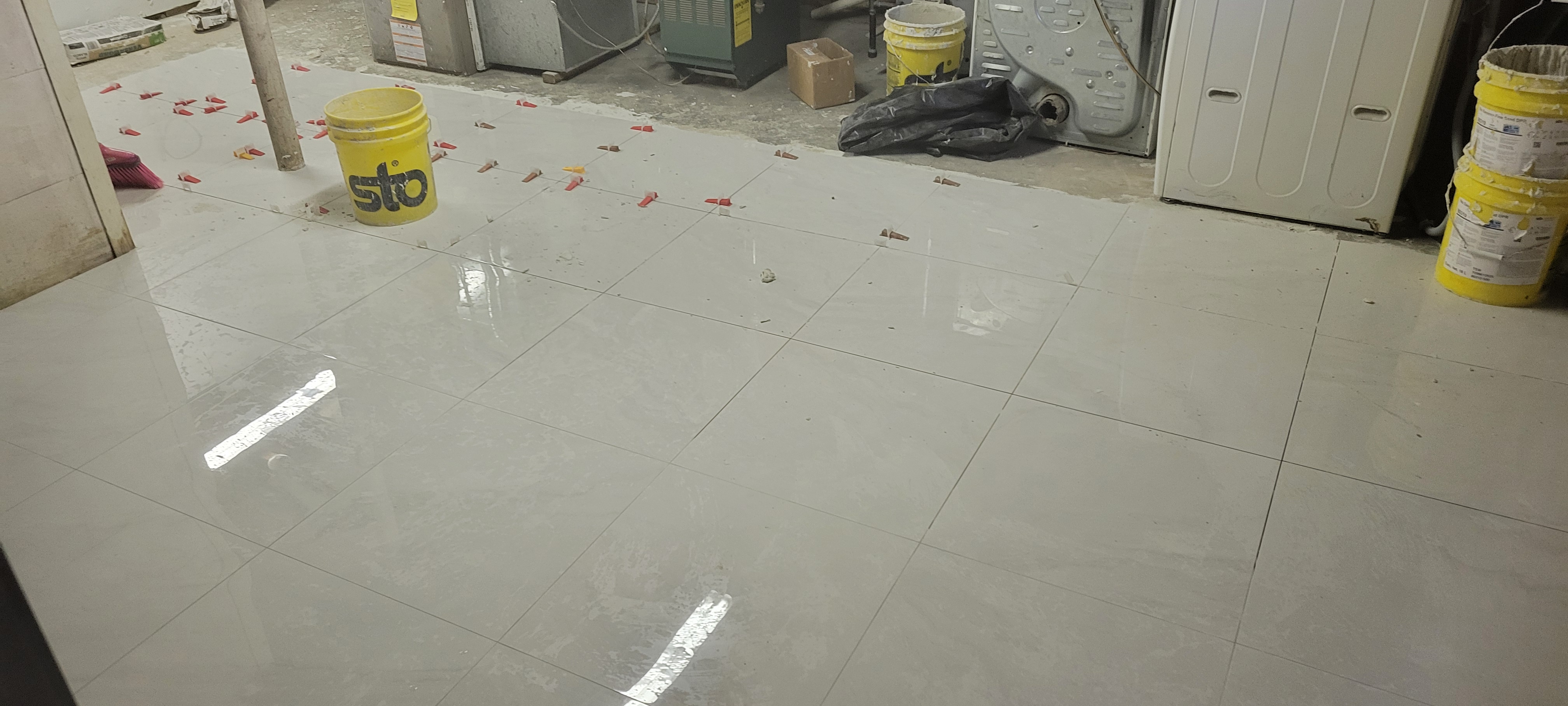 Walking Whole Floor porcelain installation of 24 x 24 tiles